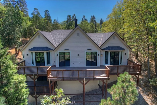 1285 N State Highway 173, Lake Arrowhead, CA 92352 - back of property featuring roof with shingles, a wooden deck, and a view of trees