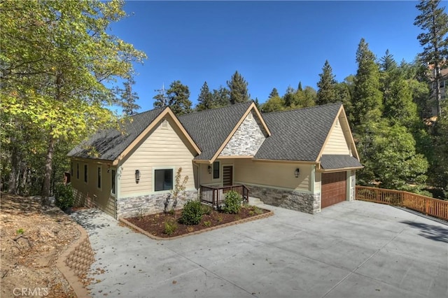 1285 N State Highway 173, Lake Arrowhead, CA 92352 - single story home with stone siding, an attached garage, driveway, and roof with shingles