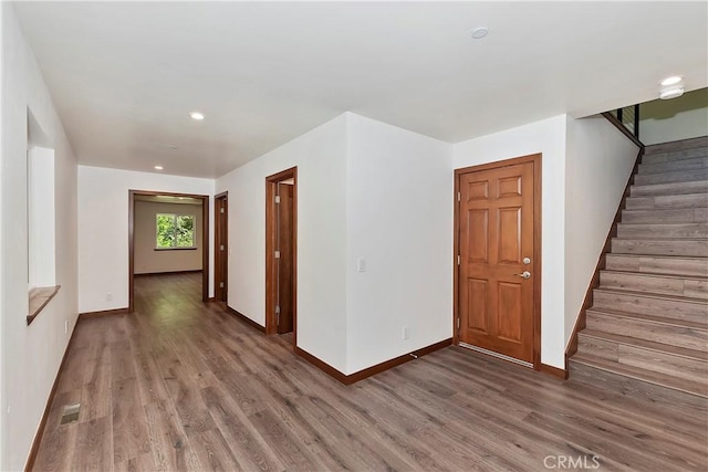1285 N State Highway 173, Lake Arrowhead, CA 92352 - hallway featuring wood finished floors, stairway, baseboards, and recessed lighting