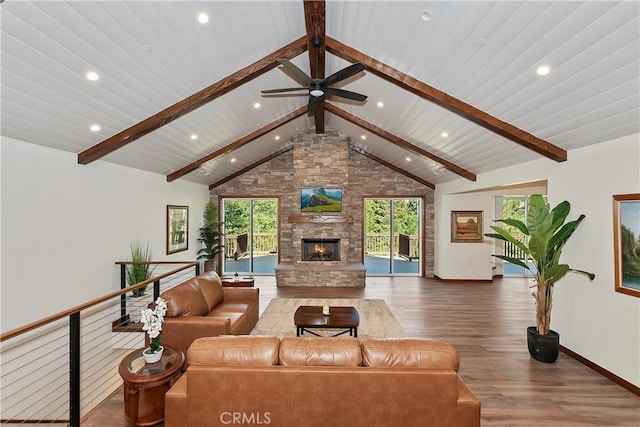 living room featuring beam ceiling, a stone fireplace, high vaulted ceiling, and dark hardwood / wood-style floors