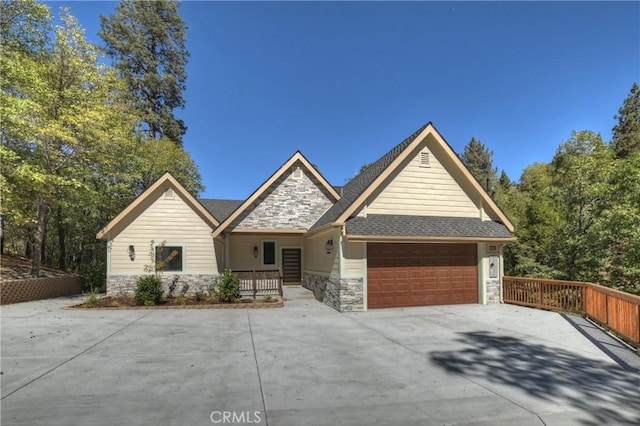 view of front of property with a porch and a garage