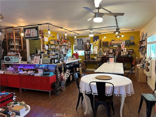 dining room with ceiling fan and wood-type flooring