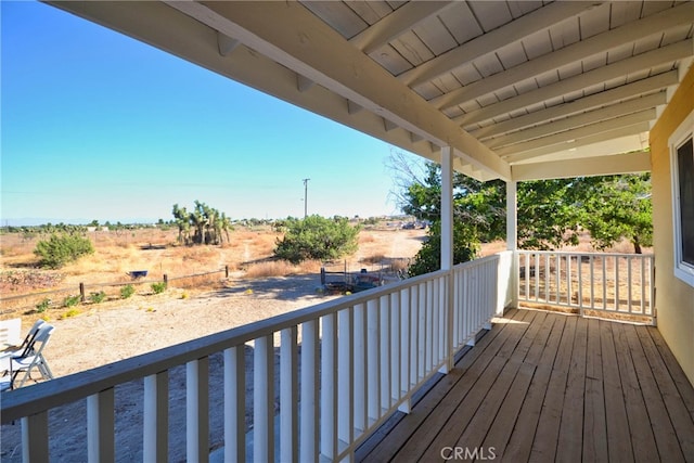 wooden deck featuring a rural view