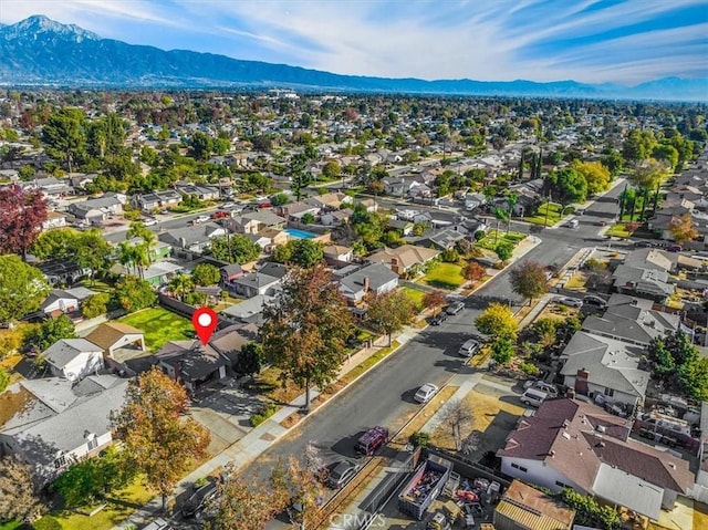 birds eye view of property with a mountain view