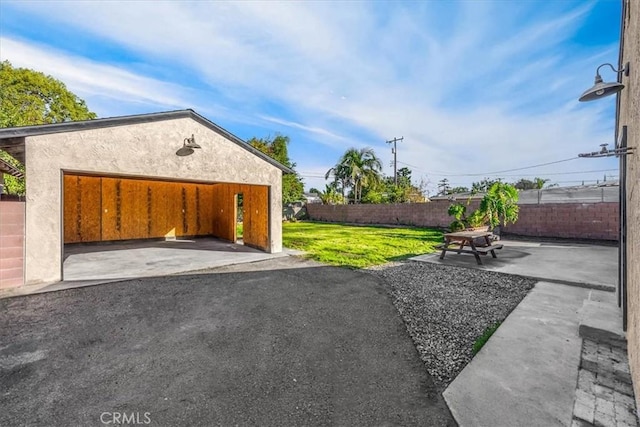 garage featuring a yard