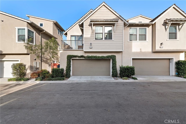 townhome / multi-family property featuring a garage