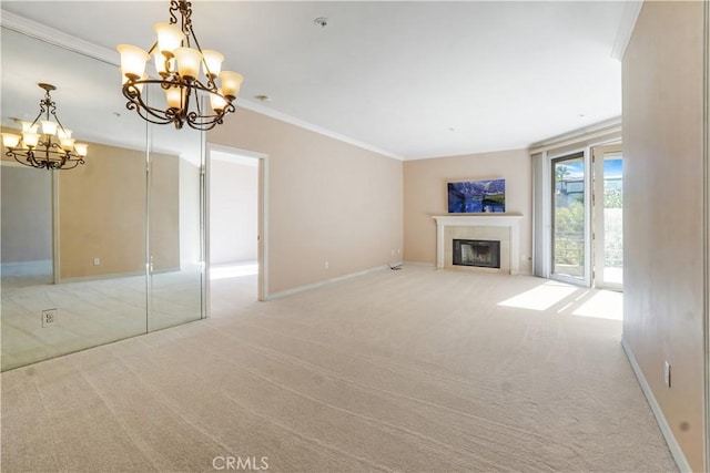 unfurnished living room featuring a notable chandelier, crown molding, and light carpet