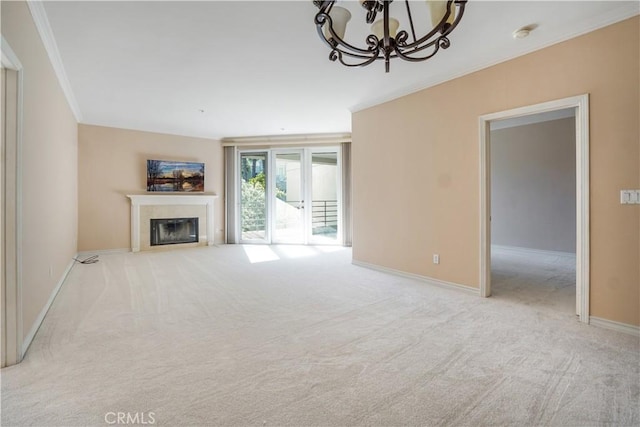 unfurnished living room with light carpet, a chandelier, and crown molding