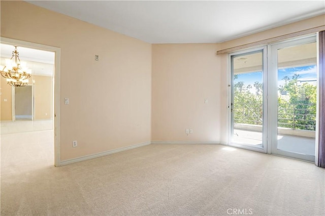 unfurnished room with light carpet and an inviting chandelier