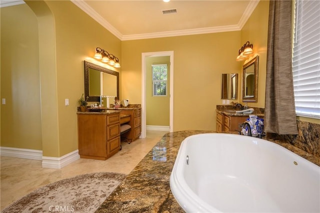 bathroom featuring crown molding, a washtub, and vanity