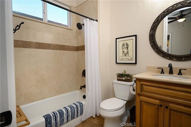 full bathroom featuring vanity, tile patterned floors, shower / bath combination with curtain, ceiling fan, and toilet