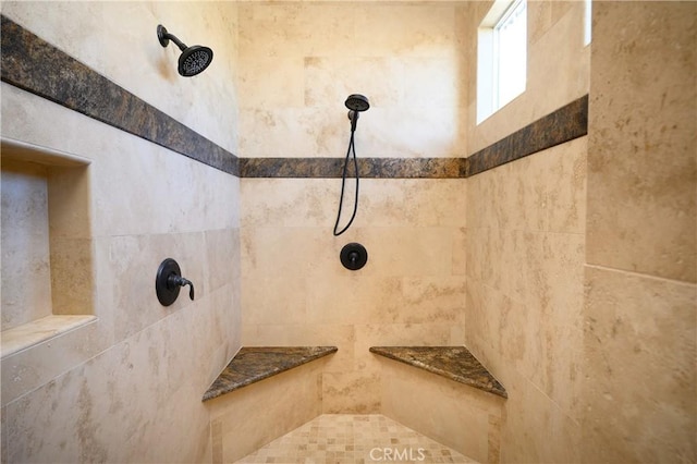 bathroom featuring tiled shower