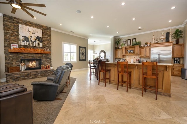 kitchen with a large island, a breakfast bar, and built in refrigerator