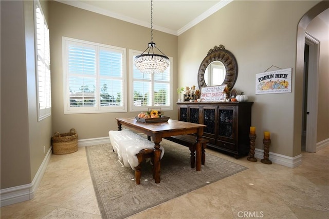 dining space with a notable chandelier and ornamental molding