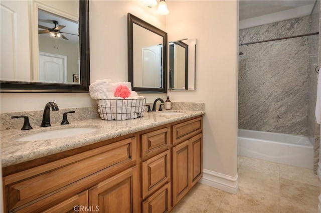 bathroom with shower / bathing tub combination, vanity, and ceiling fan