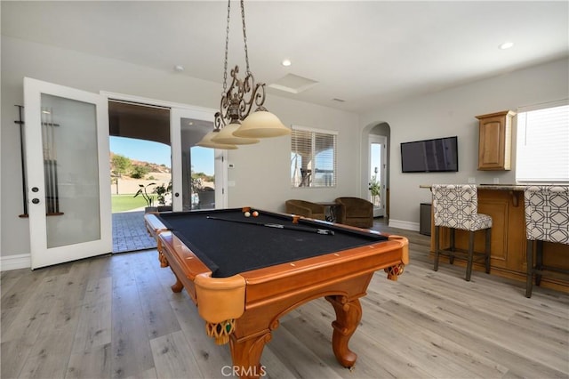 game room featuring french doors, light hardwood / wood-style flooring, and pool table