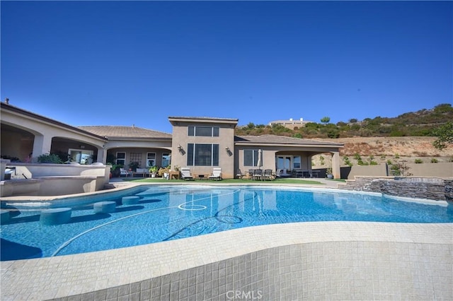 view of swimming pool featuring a patio