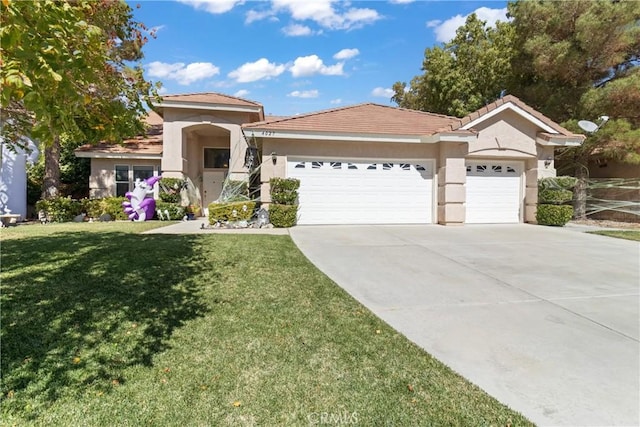 view of front facade with a front yard and a garage