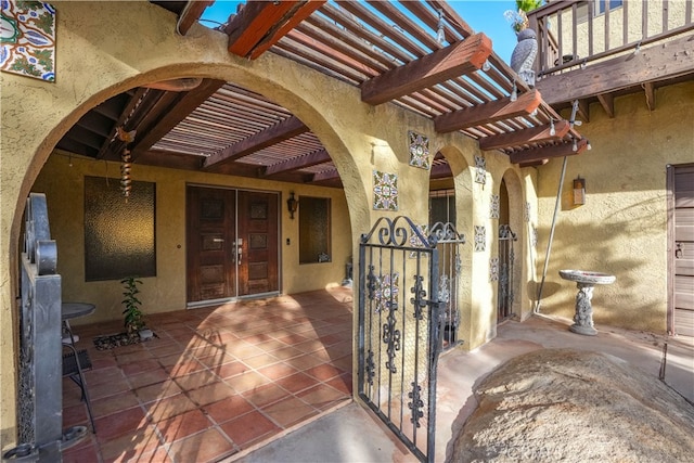 view of exterior entry featuring french doors