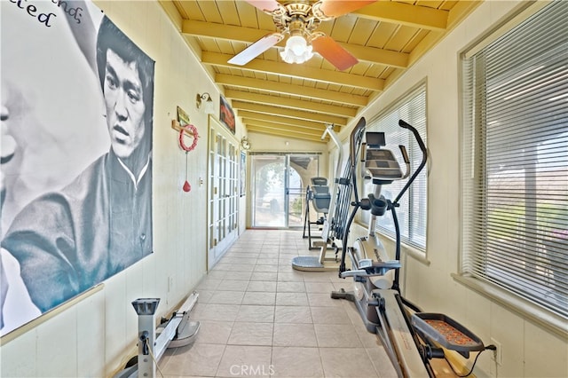 exercise area with vaulted ceiling, ceiling fan, light tile patterned floors, and wooden ceiling