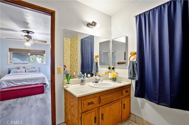 bathroom featuring vanity, wood-type flooring, and ceiling fan