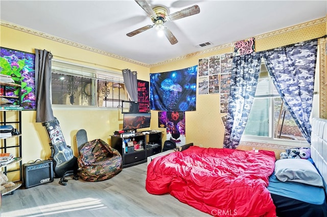 bedroom featuring ceiling fan and wood-type flooring