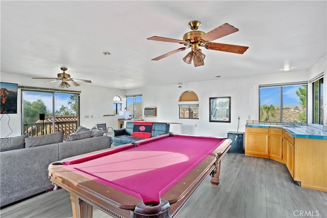 rec room featuring ceiling fan, a healthy amount of sunlight, light hardwood / wood-style flooring, and pool table