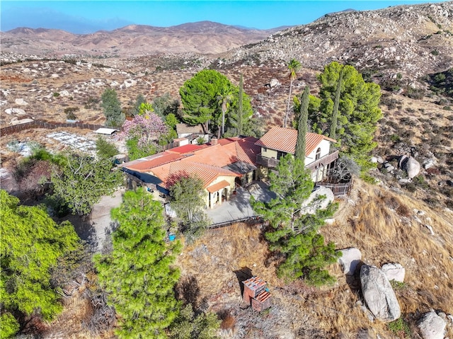 birds eye view of property with a mountain view