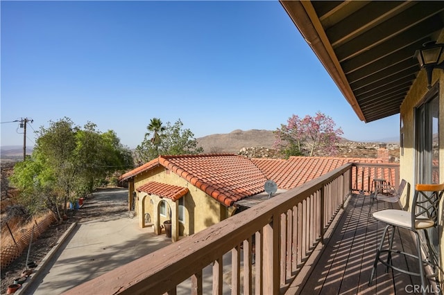 balcony featuring a mountain view