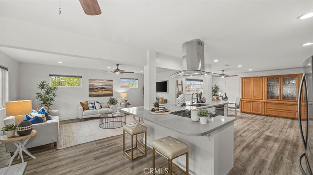 15757 Creswick Dr, La Mirada, CA 90638 - kitchen with ceiling fan, island exhaust hood, a sink, recessed lighting, and gas stovetop