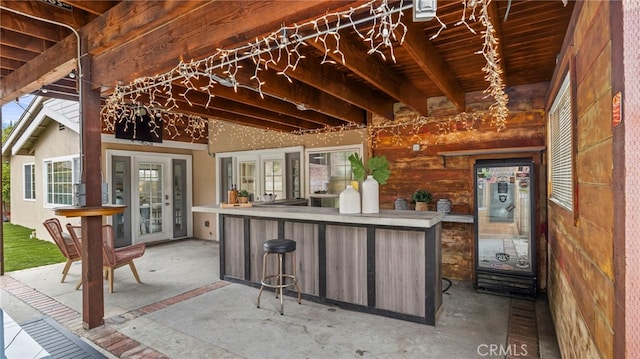 view of patio / terrace featuring french doors and an outdoor bar