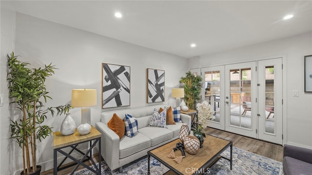 living room with hardwood / wood-style floors and french doors