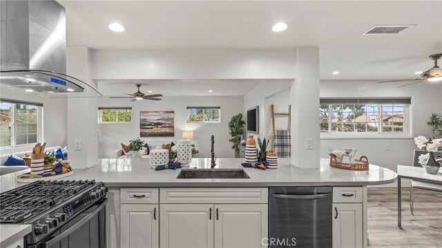 15757 Creswick Dr, La Mirada, CA 90638 - kitchen featuring stainless steel dishwasher, island range hood, ceiling fan, a sink, and recessed lighting