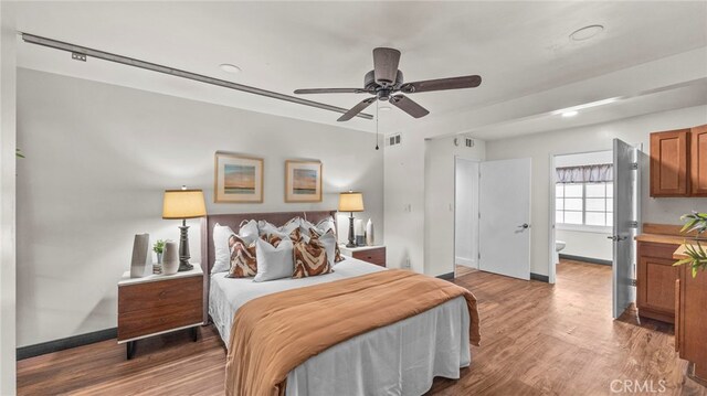 bedroom featuring ceiling fan and wood-type flooring