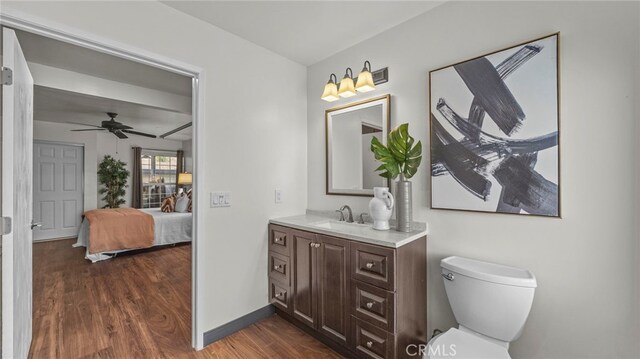 15757 Creswick Dr, La Mirada, CA 90638 - bathroom featuring vanity, wood finished floors, a ceiling fan, ensuite bath, and toilet