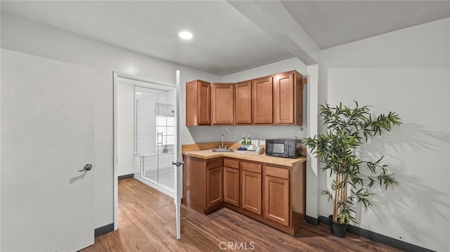 kitchen with wood-type flooring and sink