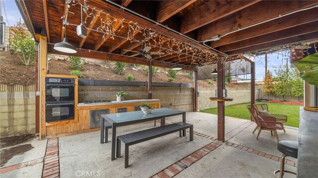 15757 Creswick Dr, La Mirada, CA 90638 - fenced backyard with ceiling fan and a patio area