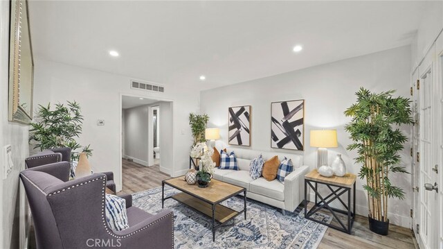 15757 Creswick Dr, La Mirada, CA 90638 - living room featuring light wood finished floors, recessed lighting, and baseboards