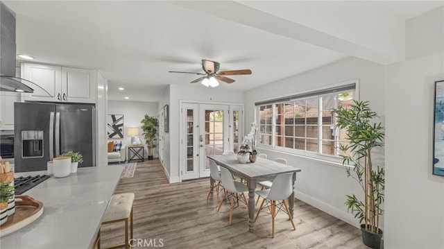 dining area featuring ceiling fan and hardwood / wood-style flooring