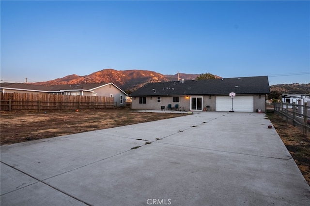 ranch-style house featuring a mountain view and a garage