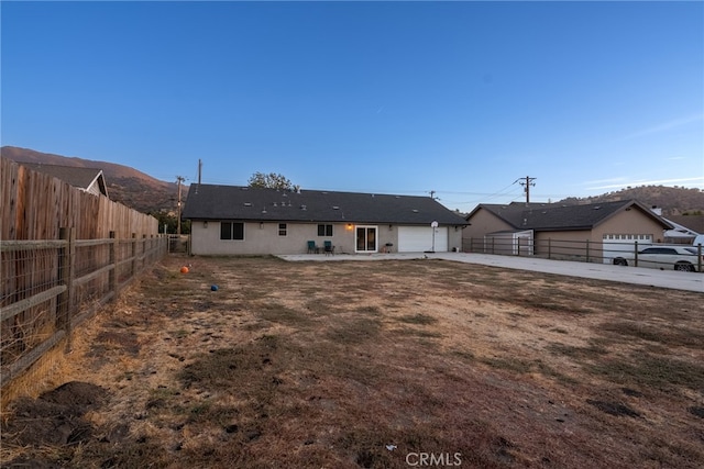 rear view of house featuring a mountain view