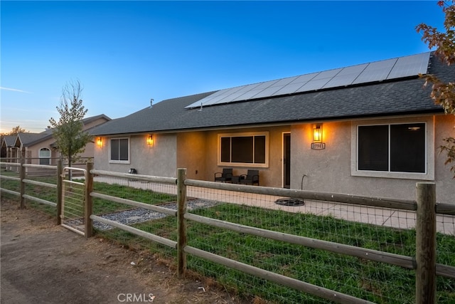 view of front of house with solar panels