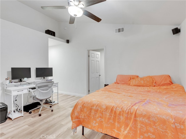 bedroom with ceiling fan, high vaulted ceiling, and light wood-type flooring