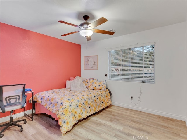 bedroom featuring light hardwood / wood-style floors and ceiling fan