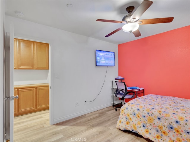 bedroom featuring light hardwood / wood-style flooring and ceiling fan