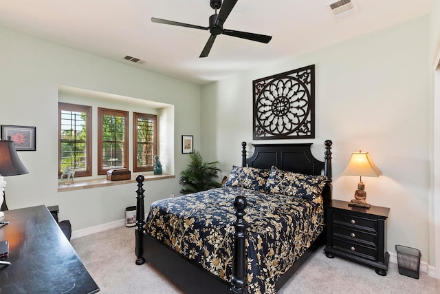 bedroom with ceiling fan and light carpet