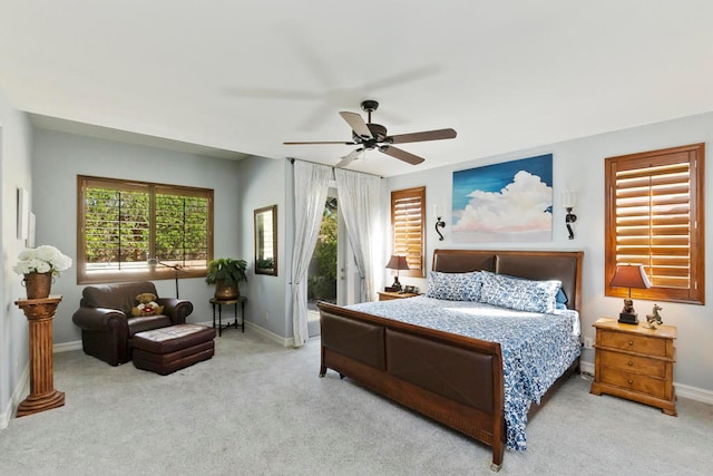 carpeted bedroom with access to outside and ceiling fan