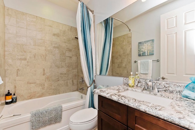 full bathroom featuring vanity, toilet, and shower / tub combo with curtain