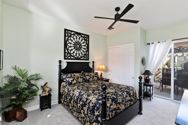 bedroom with access to exterior, ceiling fan, a closet, and light carpet