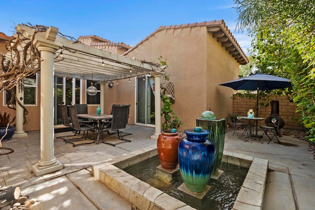 view of patio featuring a pergola